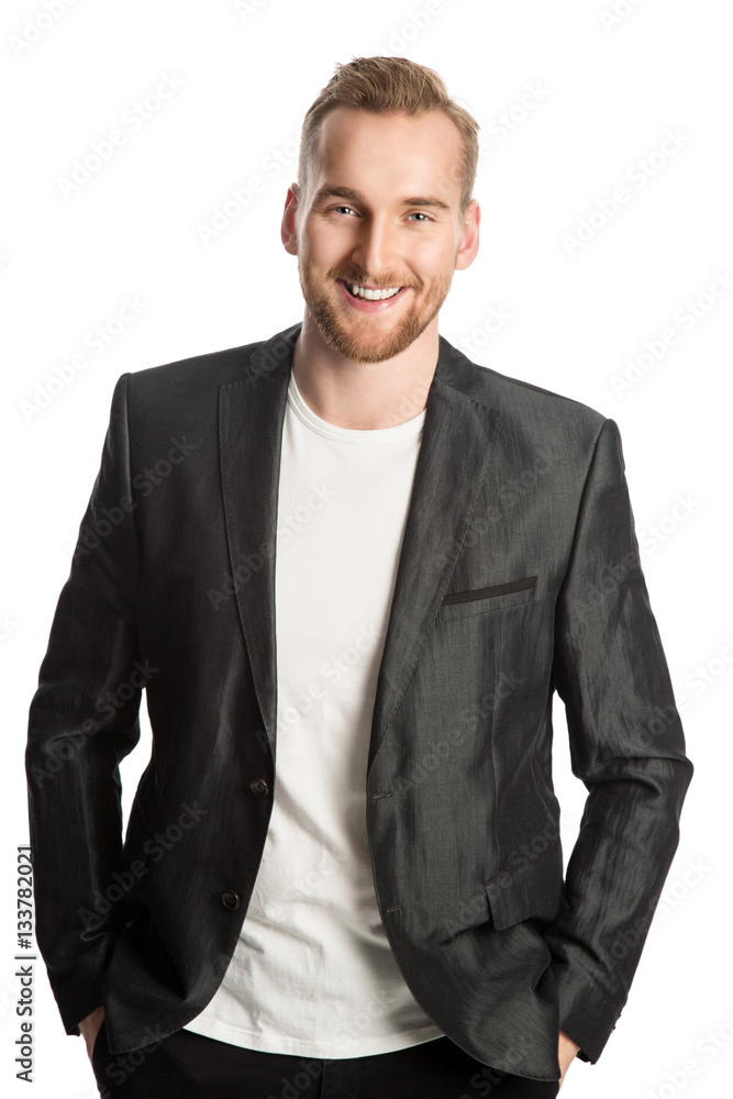 Handsome trendy man in a linen jacket standing against a white background smiling. Handsome trendy man in a linen jacket standing against a white background smiling.