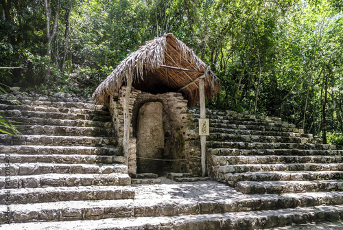 ruins of a structure and of a stela in the archaeological place of Coba, in Qintana Roo, Mexico photo