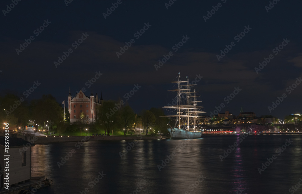 View  of the Skeppsholmen and Sodermalm at night time in Stockholm, Sweden.