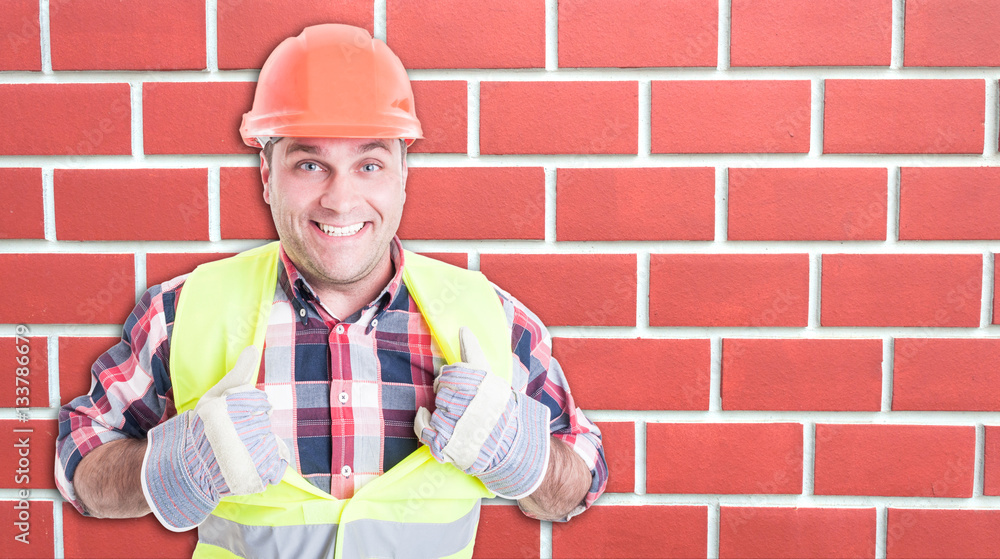 Happy builder smiling and acting like superman Happy builder smiling and acting like superman