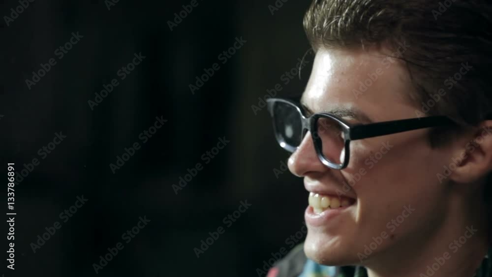 Close-up face of smiling man in glasses Close-up face of smiling man in glasses