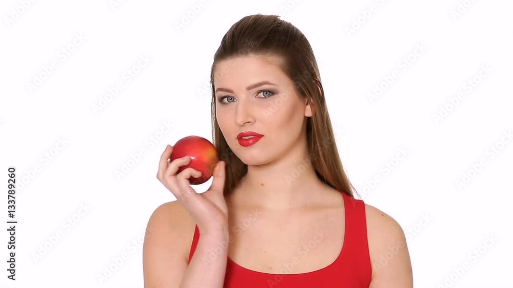 woman holding red Apple and smiling on white background woman holding red Apple and smiling on white background