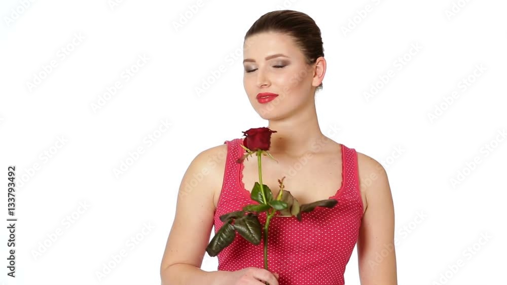 woman holding red rose and smiling on a white background. woman holding red rose and smiling on a white background.