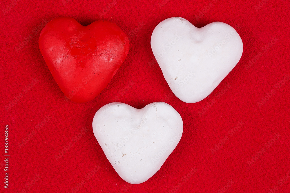 Obraz premium red carrot on a red background, Valentine's Day