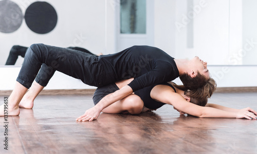 Nice slim man lying on his dance partner