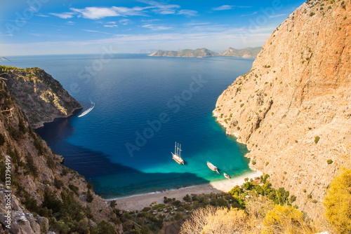 Fototapeta Naklejka Na Ścianę i Meble -  Butterfly valley sea view and boat Oludeniz,Turkey