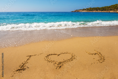 Message i love you on sand beach