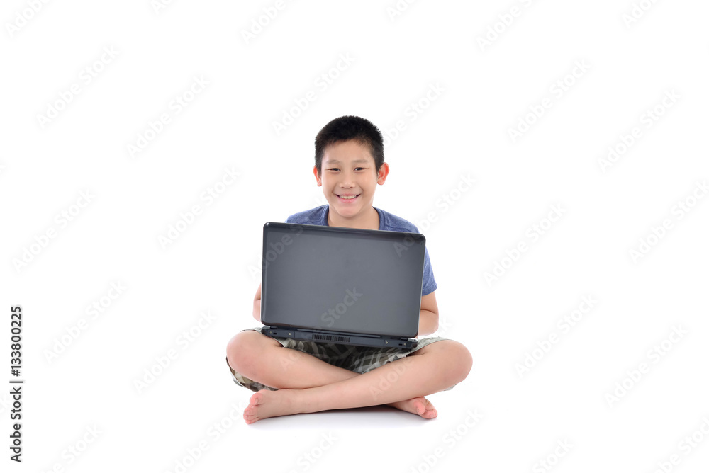 Asian boy with laptop sitting on white background Asian boy with laptop sitting on white background