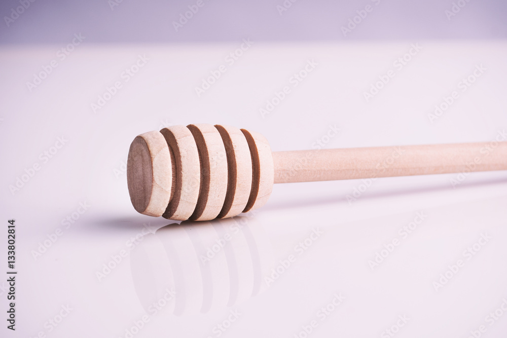 Honey spoon on white background Honey spoon on white background
