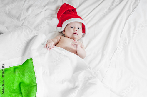 Cute little newborn santa baby