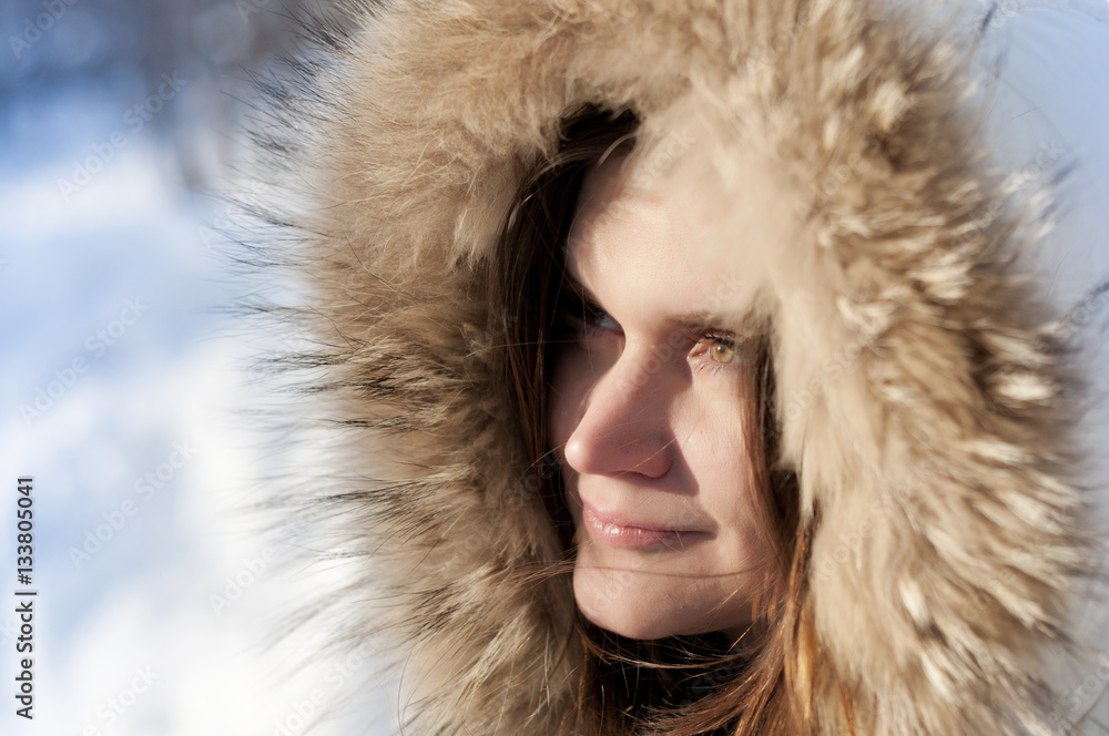 Sunny winter day , the girl in the hood with natural fur Sunny winter day , the girl in the hood with natural fur