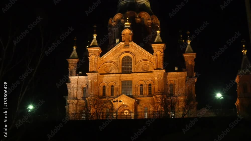 Timelapse of people walking infront of Uspenski Cathedral, at a dark evening night, in Helsinki, Finland Timelapse of people walking infront of Uspenski Cathedral, at a dark evening night, in Helsinki, Finland