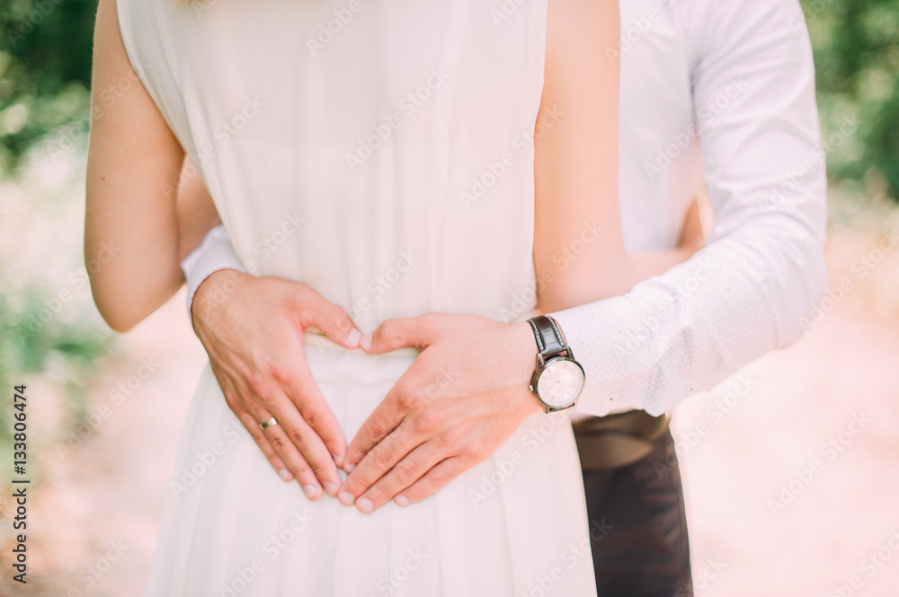 picture of man and woman making a heart by hands picture of man and woman making a heart by hands