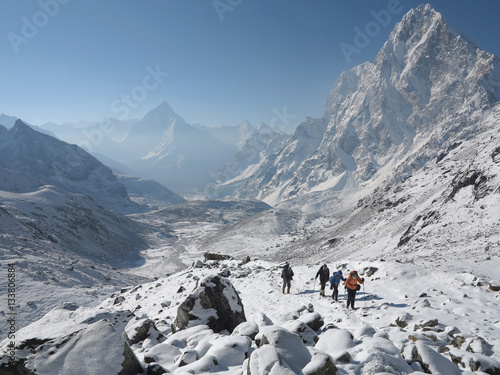 Himalayas - Mountain pass with trekkers photo