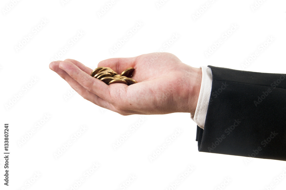 man in a suit holding coins in the hand