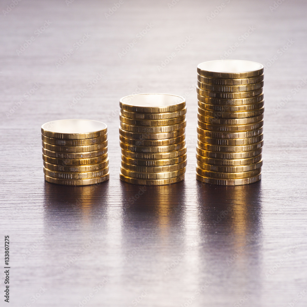 three rows of gold stack coins three rows of gold stack coins
