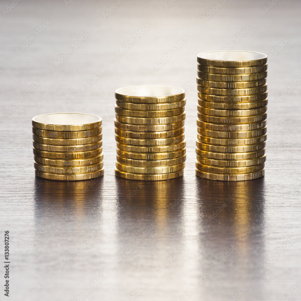 three rows of gold stack coins three rows of gold stack coins