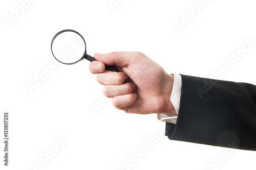 hand holding magnifier glass