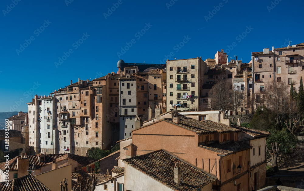 View to hanging houses of Cuenca old town. Outstanding example of a medieval city, built on the steep sides of a mountain. Many casas colgadas are built right up to the cliff edge. Cuenca, Spain