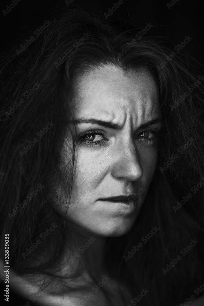 Black and white portrait of crying woman