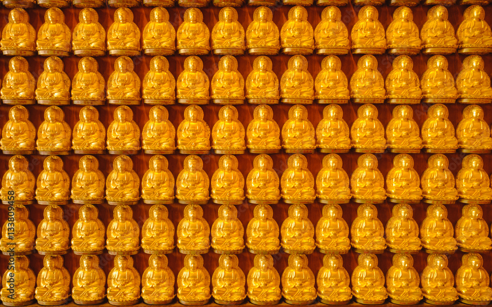Fototapeta premium Buddha gold statue chinese architecture on the wall ,Wat Mangkon Kamalawat ,Chinese style Temple in Thailand