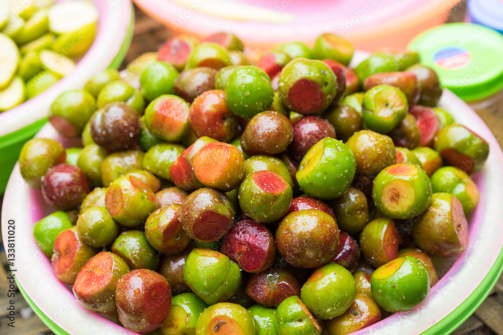 Hanoi street food, pickle fresh plum fruit