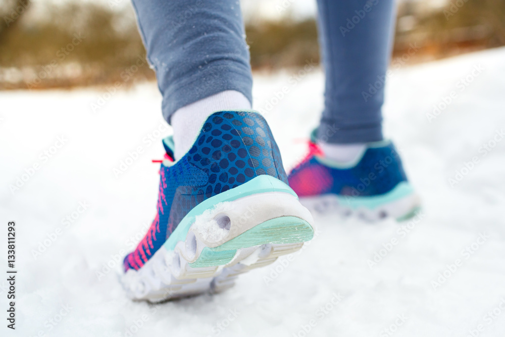 Runner getting ready for jogging outdoors in winter Runner getting ready for jogging outdoors in winter