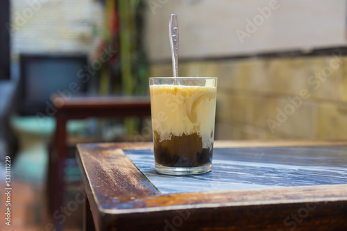 A cup of Giang egg coffee in Hanoi, found in 1946. The coffee is brewed in a small cup with a filter before the addition of a well-whisked mixture of the yolk and other ingredients