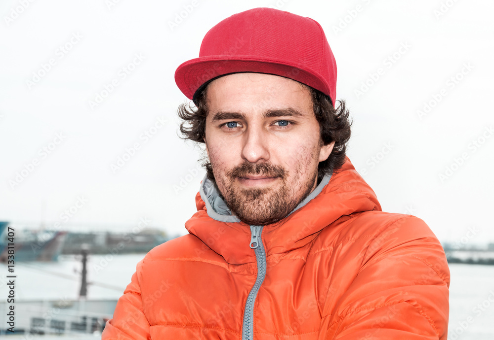 Portrait of a young successful man on the background sea landsca Portrait of a young successful man on the background sea landsca