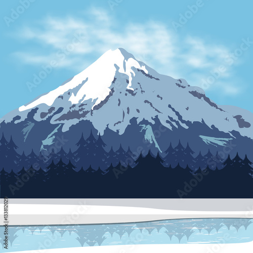 Mountain landscape with forest and frozen river. Clear sky with clouds above the peak of the slope