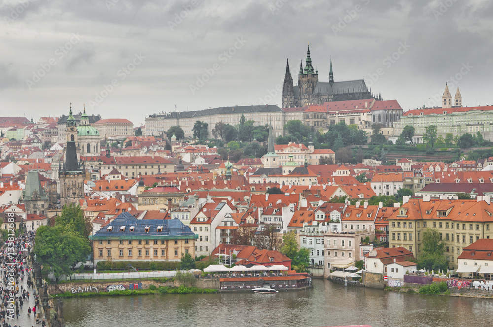 Panoramic View on the autumn Prague City with Castle and St. Nic