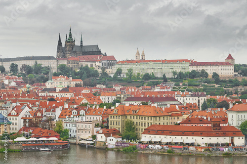 Panoramic View on the autumn Prague City with Castle and St. Nic