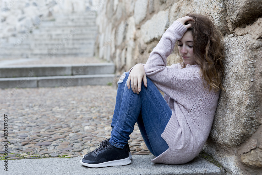 Young woman sitting on the steps