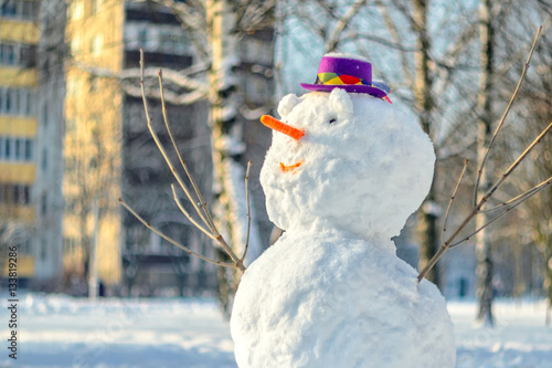 Snowman with purple hat.