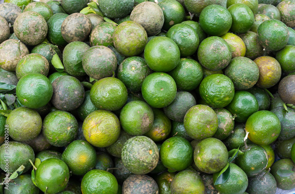 Lemon, tropical fruit displayed at Vinh Long fruit market, Mekong delta. The majority of Vietnam's fruits come from the many orchards of the Mekong Delta Lemon, tropical fruit displayed at Vinh Long fruit market, Mekong delta. The majority of Vietnam's fruits come from the many orchards of the Mekong Delta