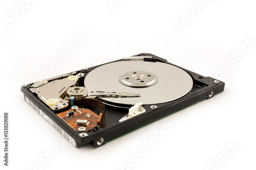 Laptop HDD on the white background. Disassembled hard disk (without top cover). inside view of notebook hard disk.
