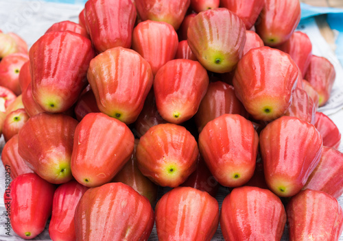 Rose-apple, tropical fruit displayed at Vinh Long fruit market, Mekong delta. The majority of Vietnam's fruits come from the many orchards of the Mekong Delta photo