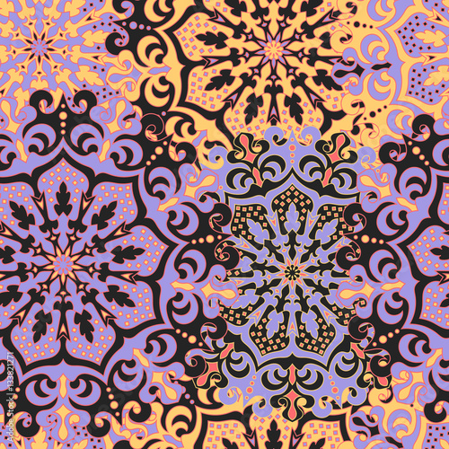 Seamless pattern with symmetrical mandalas. Ethnic texture in