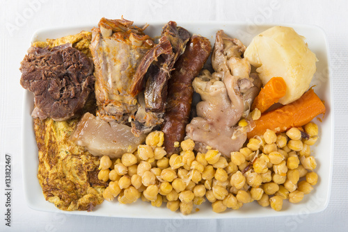 Cocido madrileño plato típico estofado de la cocina española para los días de frío a base de carnes garbanzos y verduras photo