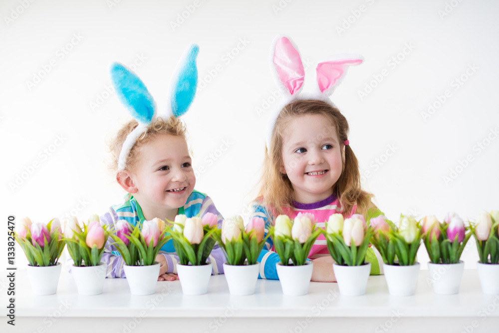Kids with bunny ears on Easter egg hunt Kids with bunny ears on Easter egg hunt