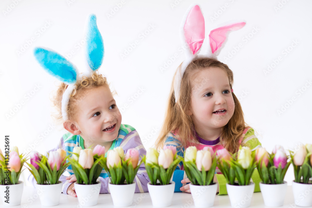 Kids with bunny ears on Easter egg hunt Kids with bunny ears on Easter egg hunt