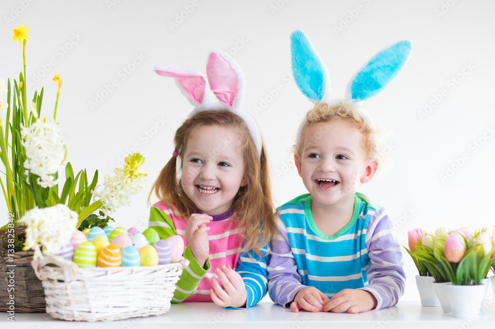 Kids with bunny ears on Easter egg hunt Kids with bunny ears on Easter egg hunt