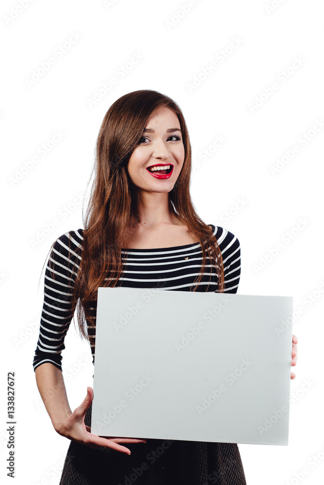 Long-haired beautiful cute brunette woman holding a rectangular blank-poster. white canvas with space for text.Red lips Long-haired beautiful cute brunette woman holding a rectangular blank-poster. white canvas with space for text.Red lips