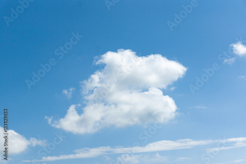 the white clouds floating on a background of blue sky