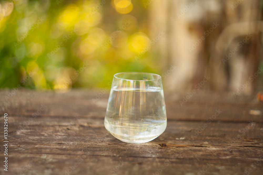 Mineral water in crystal glass on table Mineral water in crystal glass on table