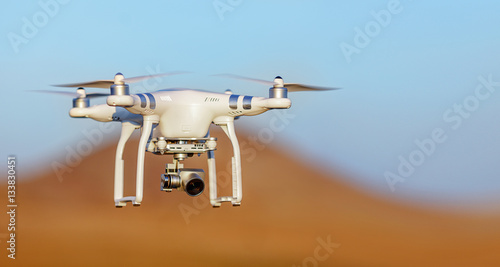 White drone quad copter with high resolution digital camera flyi