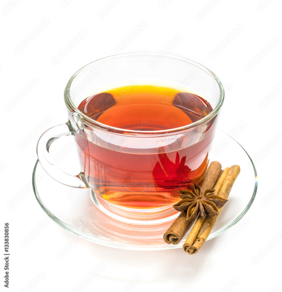 Transparent cup of tea and cinnamon steaks on white