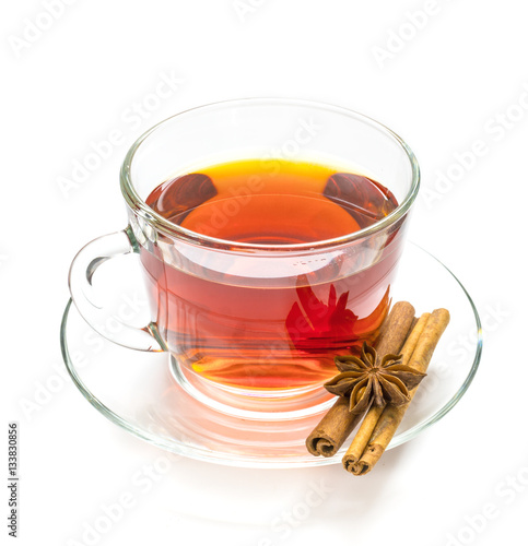 Obraz na płótnie Transparent cup of tea and cinnamon steaks on white w salonie