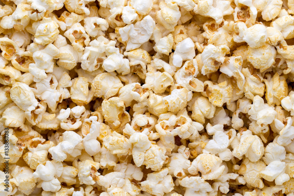 Popcorn background. Caramel sweet corn. Cinema snack.