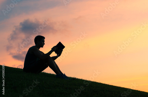 Young man reading book. 